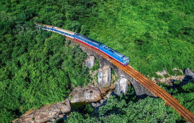 A scenic train journey passing through the Hai Van Pass near Hue, Vietnam.